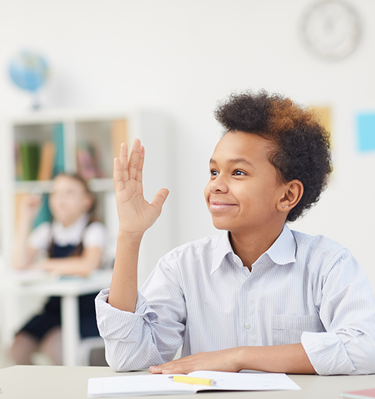 A Child Wants To Give Answer in a Class Kids Has Raised His Hand To Speak Something in a Classroom