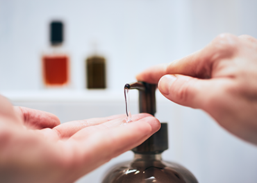 Men is sanitizing his hand