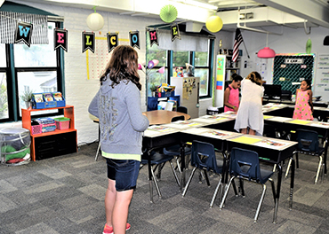 Educator offer education in a classroom